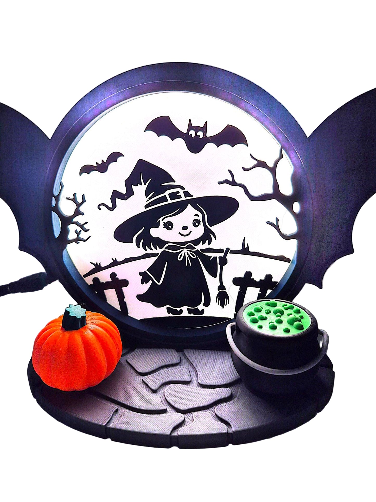 Halloween-themed decorative light with a witch, pumpkins, and bats