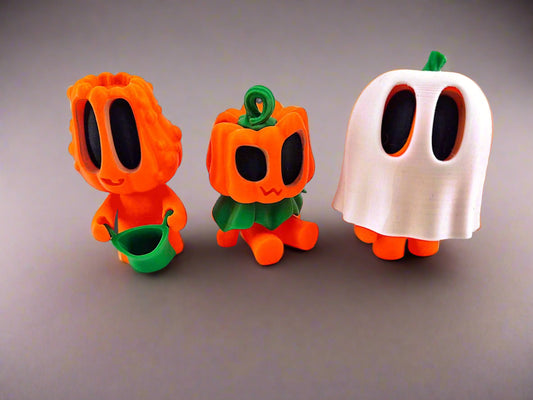 Three Halloween-themed figurines on a white background